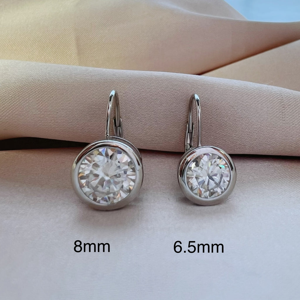 Platinum Plated 4ct Round Moissanite Bezel Set Dangling Earrings in Sterling Silver